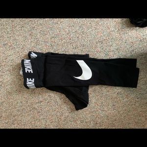 NIKE black leggings with white check on leg